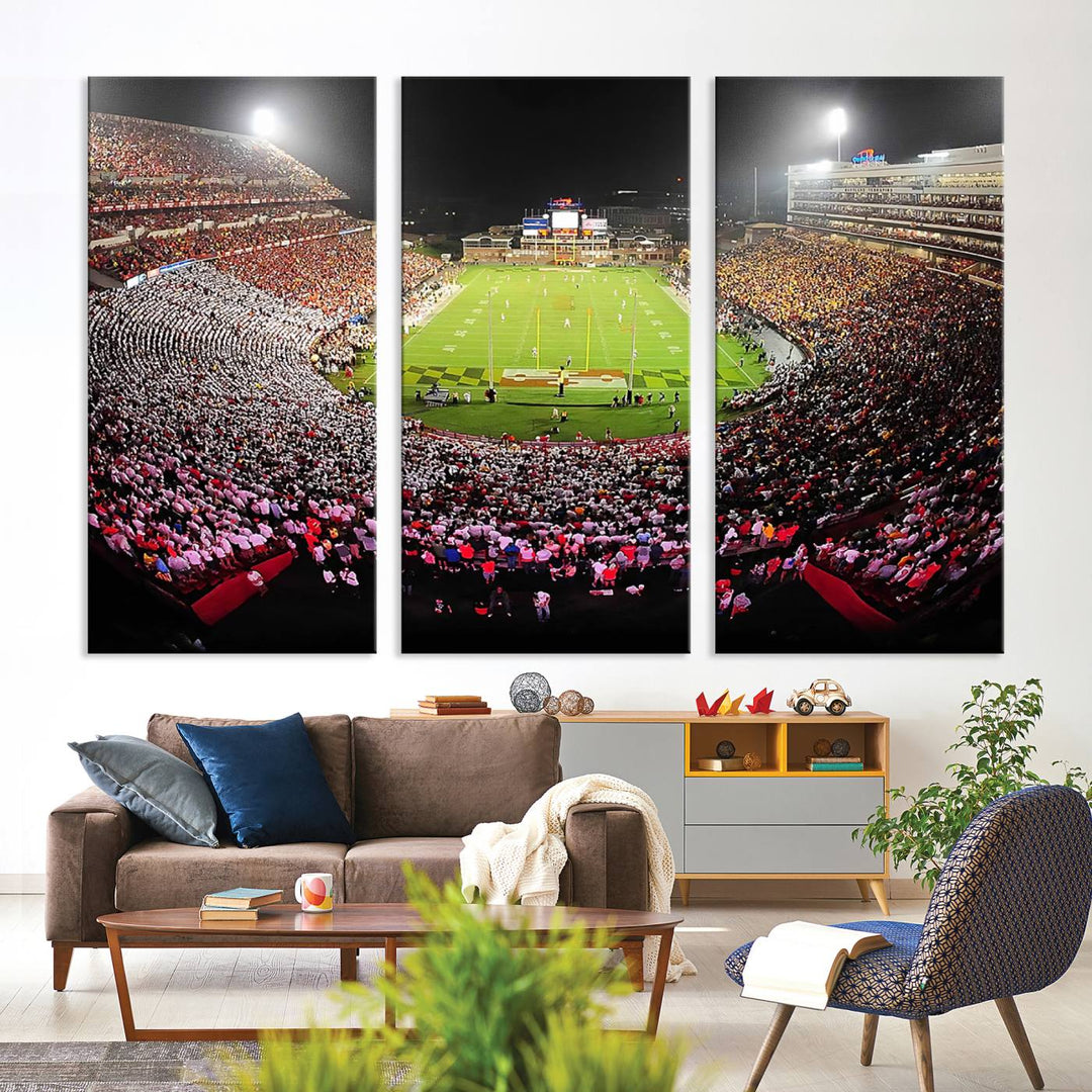 The Maryland Terrapins Football Wall Art Canvas showcases a packed SECU Stadium at night with a bright field and cheering fans.