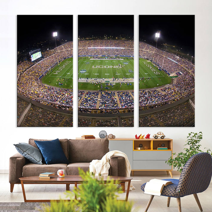 A large football stadium at night, featuring the UCONN Huskies, is depicted on the East Hartford Pratt & Whitney Stadium Wall Art Canvas Print.