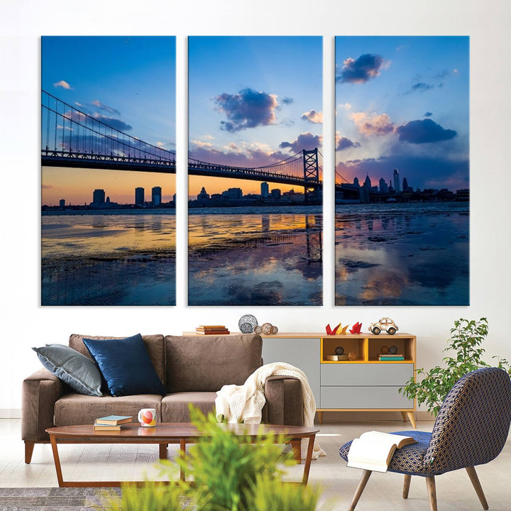 A photograph titled "Large Wall Art Philadelphia Canvas Print - Benjamin Franklin Bridge at Sunset" displays a breathtaking cityscape of the bridge reflected in the water. This image features a gallery-quality finish that promises to transform any space into an evocative memory.