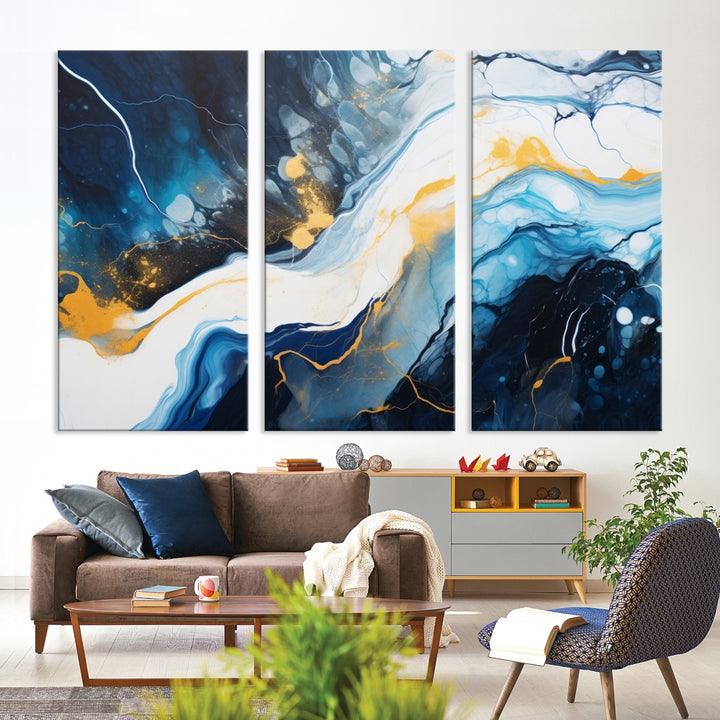 The Navy Blue Abstract Wall Art Canvas Print, displaying an exquisite array of blue, white, and gold swirls, is crafted on museum-quality canvas and enhances the space with its sophisticated elegance.