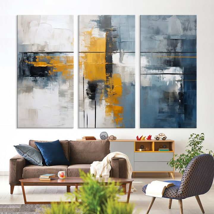 The Orange Abstract Wall Art Print features a series of white, blue, black, and yellow blocks arranged in a triptych format on museum-quality canvases. Proudly made in the USA and offered with free shipping.