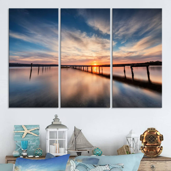 The Sunset Pier Canvas features a serene coastal landscape with vibrant hues under cloudy skies, ideal for modern decor.