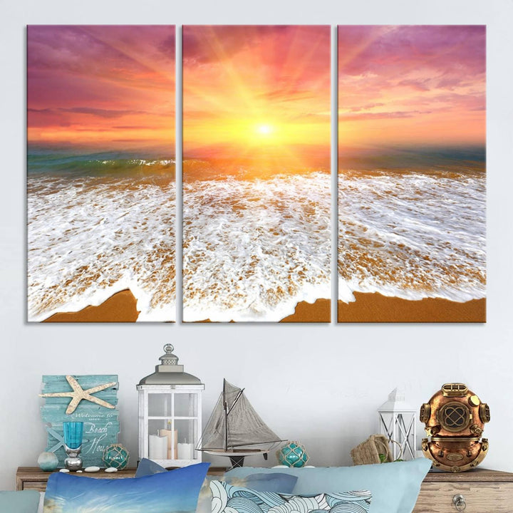 Golden Beach Sunrise 3-panel canvas art of ocean waves, hung on a wooden wall.