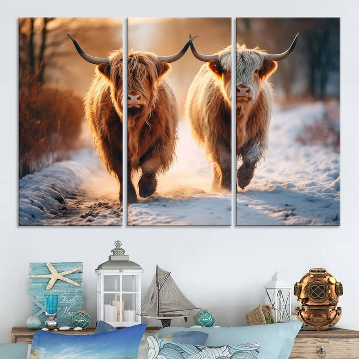 The wall art is a Scottish Highland Cow Horn canvas print featuring cows on a snowy path bathed in warm sunlight, serving as a rustic decor piece.