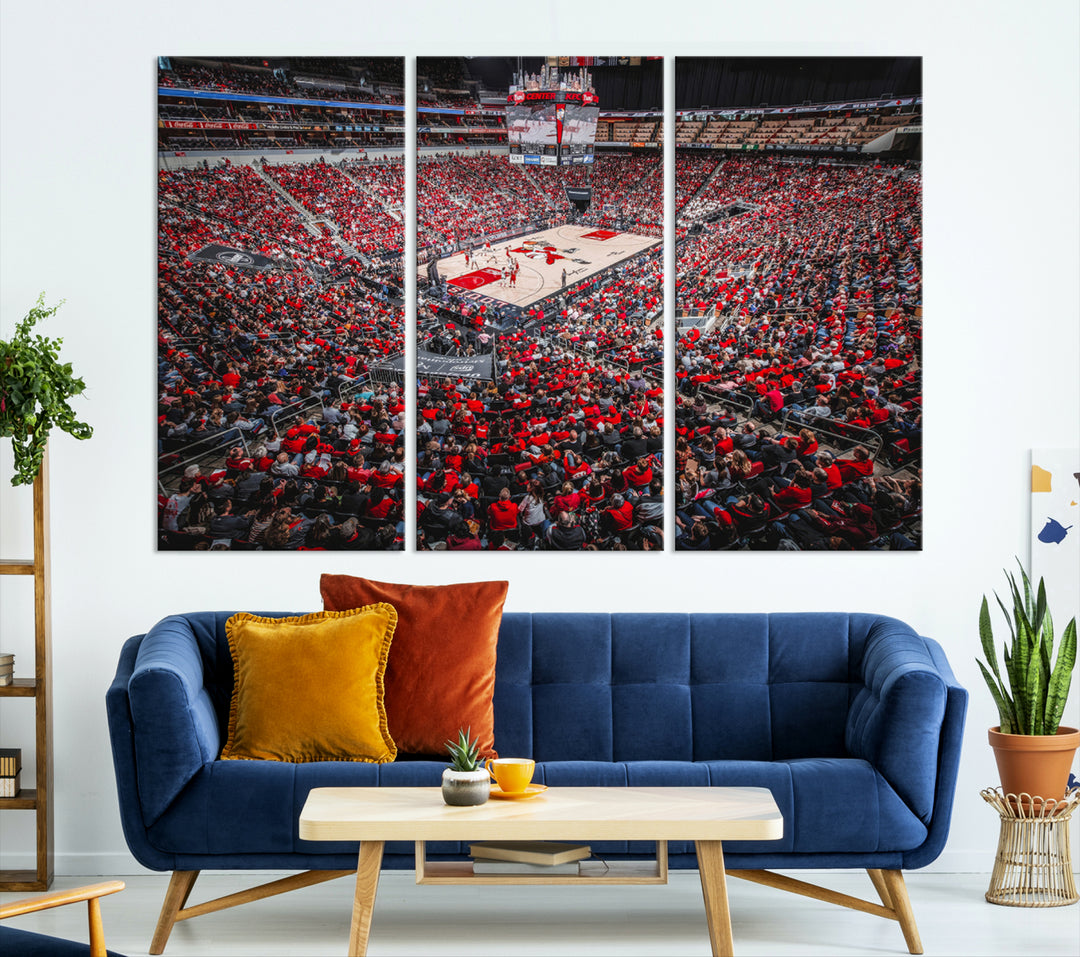 A painting of Louisville Cardinals fans in red at the KFC Yum Center Arena.