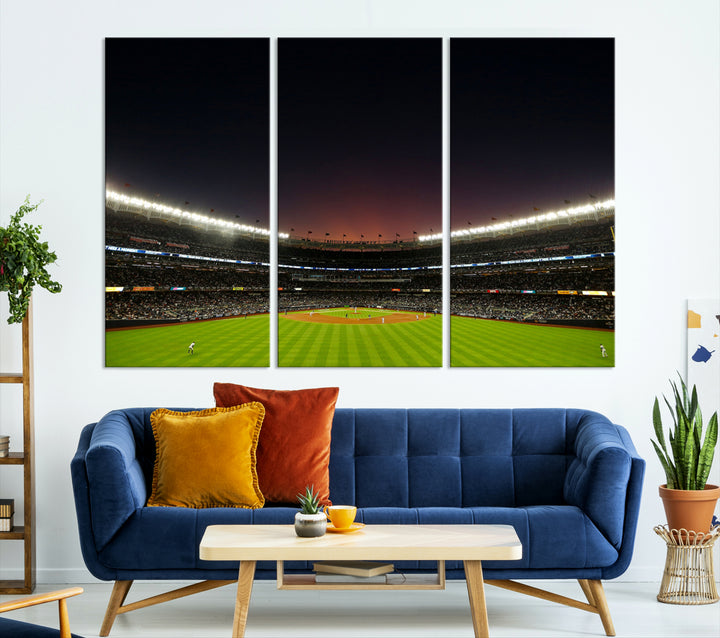 A night game at Yankee Stadium depicted on canvas beneath a sunset sky.