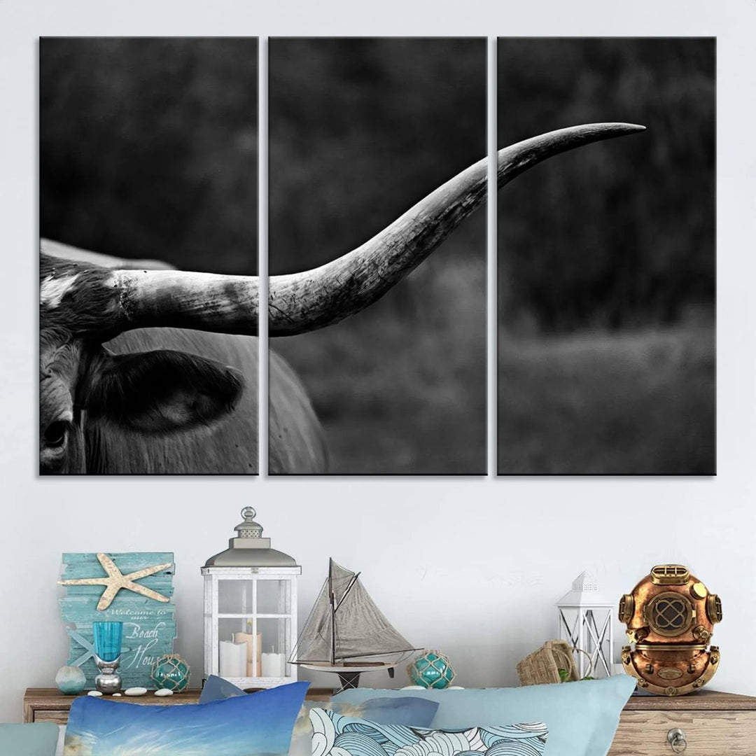 The Cow Longhorn Wall Art, a black and white print that comes ready to hang and framed, makes an ideal addition to enhance any farmhouse wall decor with rustic western barn elements.