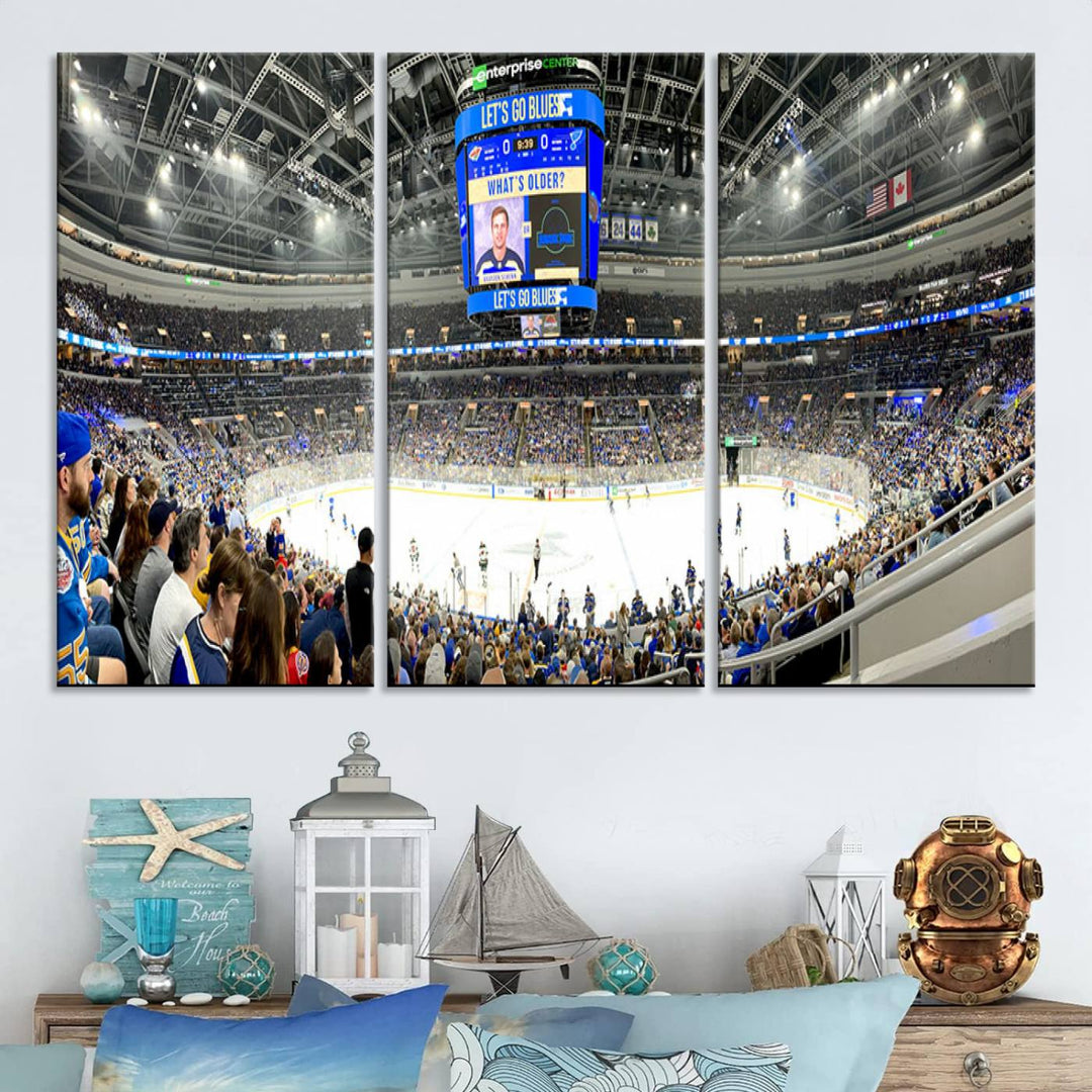 Wall art prints depicting the bustling scenes of the St. Louis Blues being cheered on by a full house at the Enterprise Center, beneath a large scoreboard.