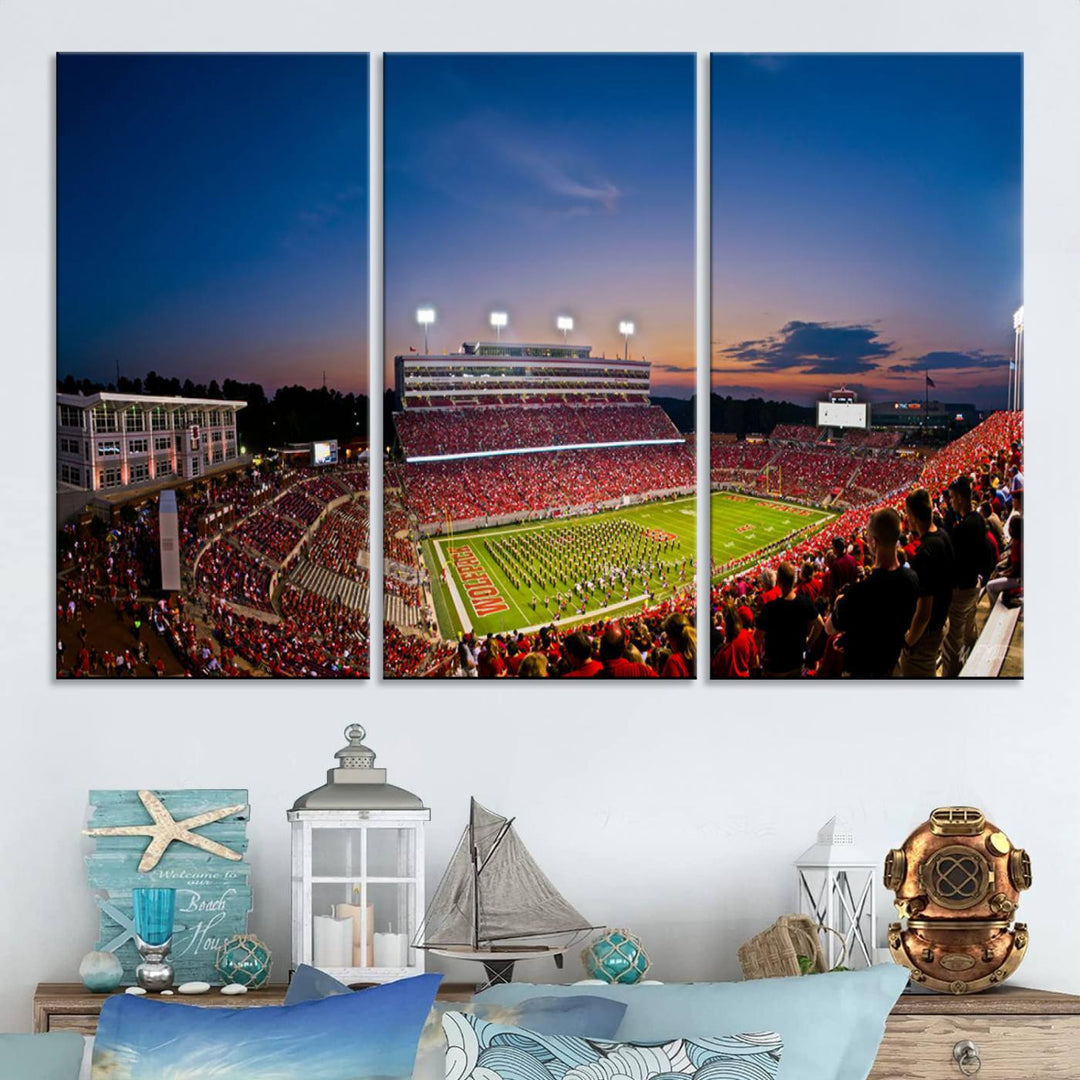 Triple-panel canvas art of Carter-Finley Stadium during an NC State Wolfpack evening football game, capturing the dynamic crowd and picturesque sunset.