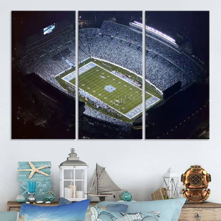 A University of North Carolina Tar Heels Football Team Print, showcasing Chapel Hill's Kenan Memorial Stadium, hangs in a modern dining room, adding a gallery-quality finish that enhances the entire space.