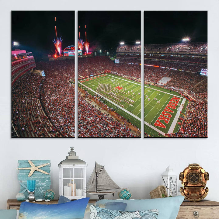 The University of Nebraska Cornhuskers Football Team Print, featuring Lincoln Memorial Stadium in a vibrant triptych canvas with fireworks above and a gallery-quality finish, is elegantly displayed.