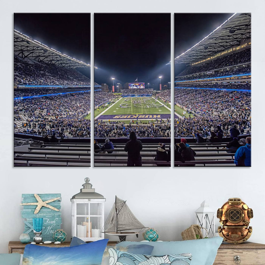 A canvas print titled The University of Washington Huskies Football depicts a packed Husky Stadium at night, as seen from the stands.