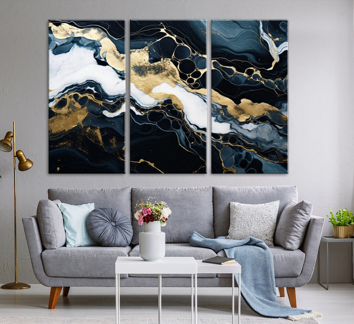 Fluid Marble Abstract Wall Art Print, a contemporary piece with black, white, and gold swirls on museum-quality canvas.