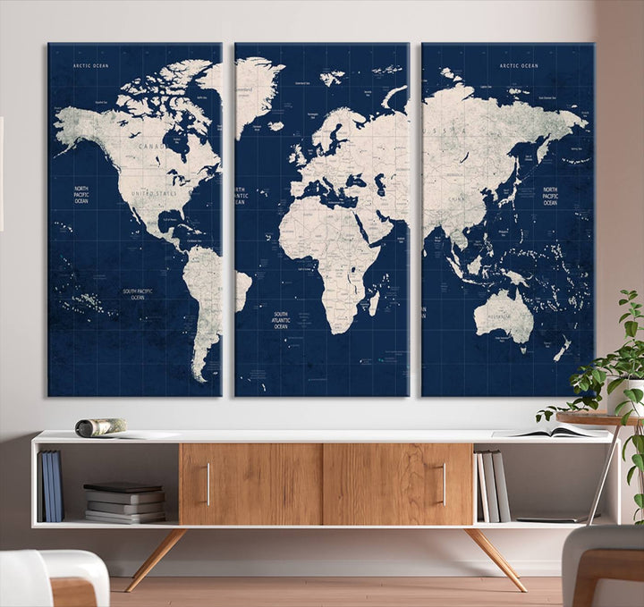 Large modern world map wall art canvas print in beige and navy; showcases a 3-panel vintage map design and is ready to hang.