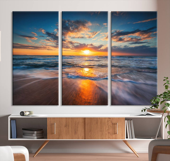 The Sunset on the Ocean canvas adds coastal ambiance to the wooden wall.