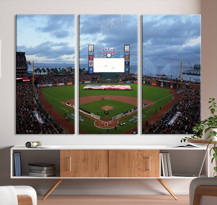 This framed 3-panel canvas MLB wall art features a giant flag and fans under a cloudy sky at Oracle Park.