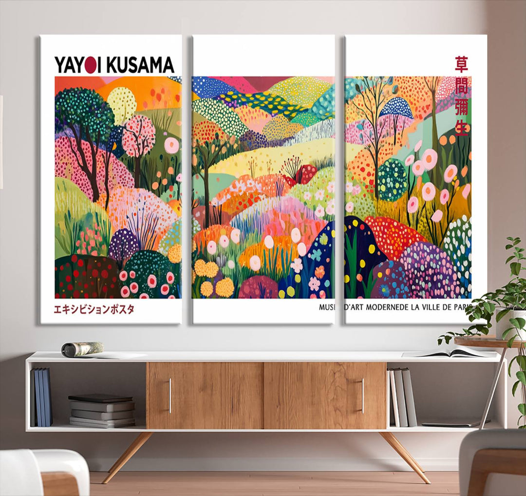 Three vibrant, abstract Yayoi Kusama wall art prints adorn a black wall, creating a perfect blend of contemporary décor.