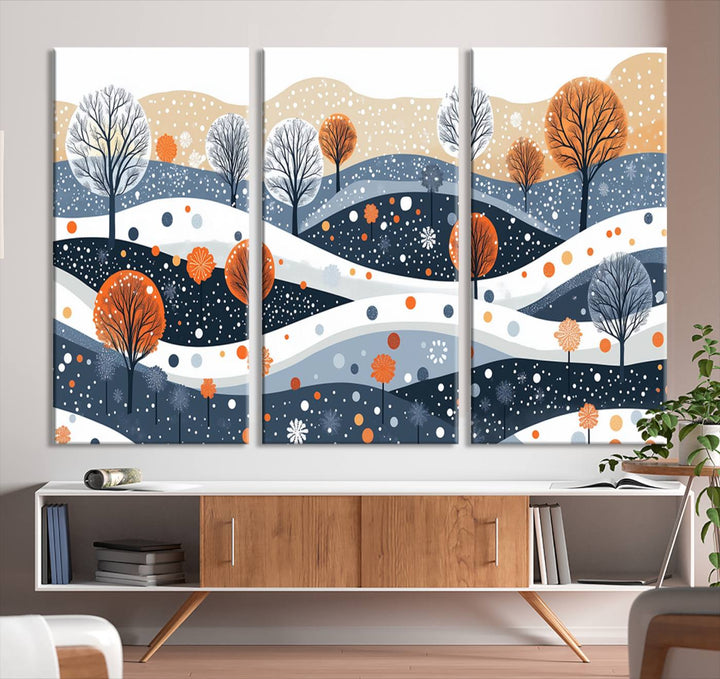 The "Abstract Winter Landscape Canvas Wall Art Print," featuring a triptych of landscapes with trees and hills in vibrant orange, white, and blue hues, adds a gallery-quality finish that transforms the space into an art lover's dream.