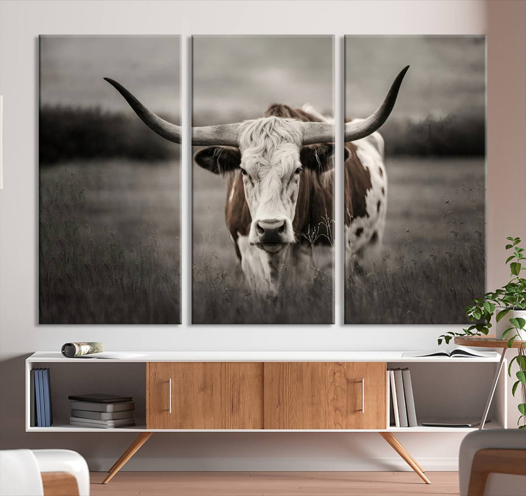 The Texas Longhorn Cow Canvas Wall Art Print adds a rustic touch to a living room.