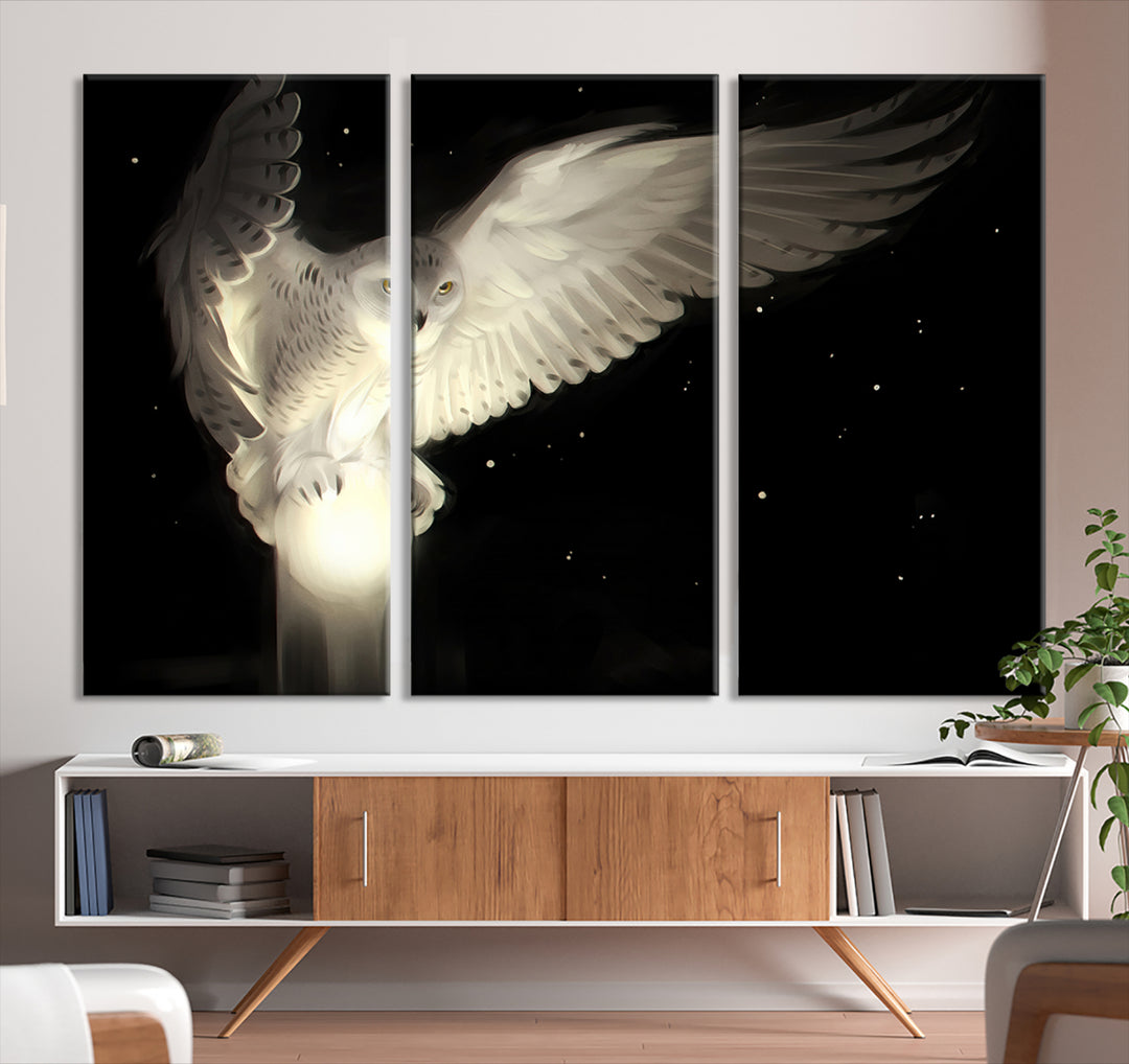 The Night Owl Art graces the wall with its depiction of a snowy owl on a glowing orb, perfect for modern decor.