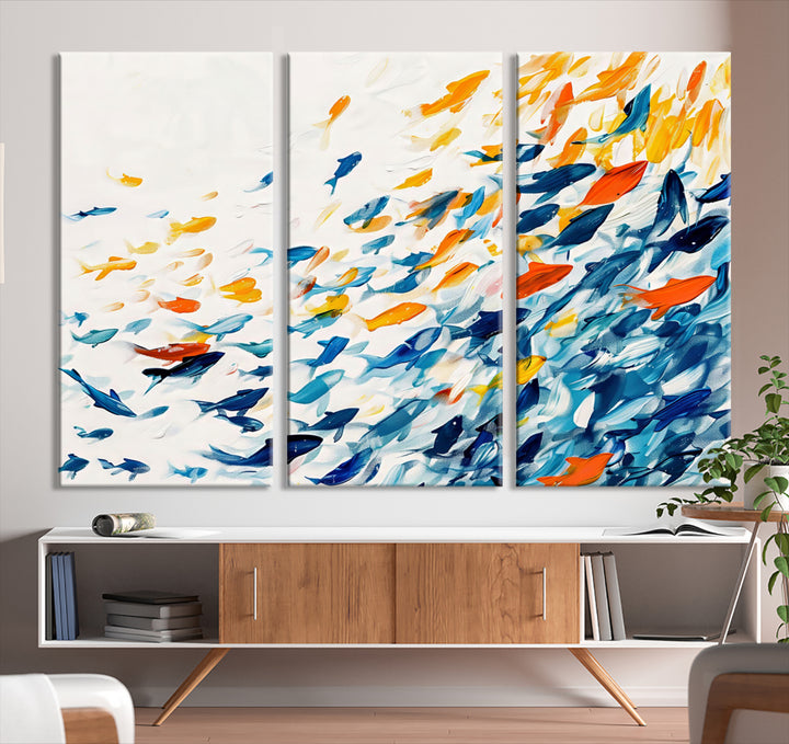 A colorful Abstract Fish Shoal Canvas Print hangs on the wall.