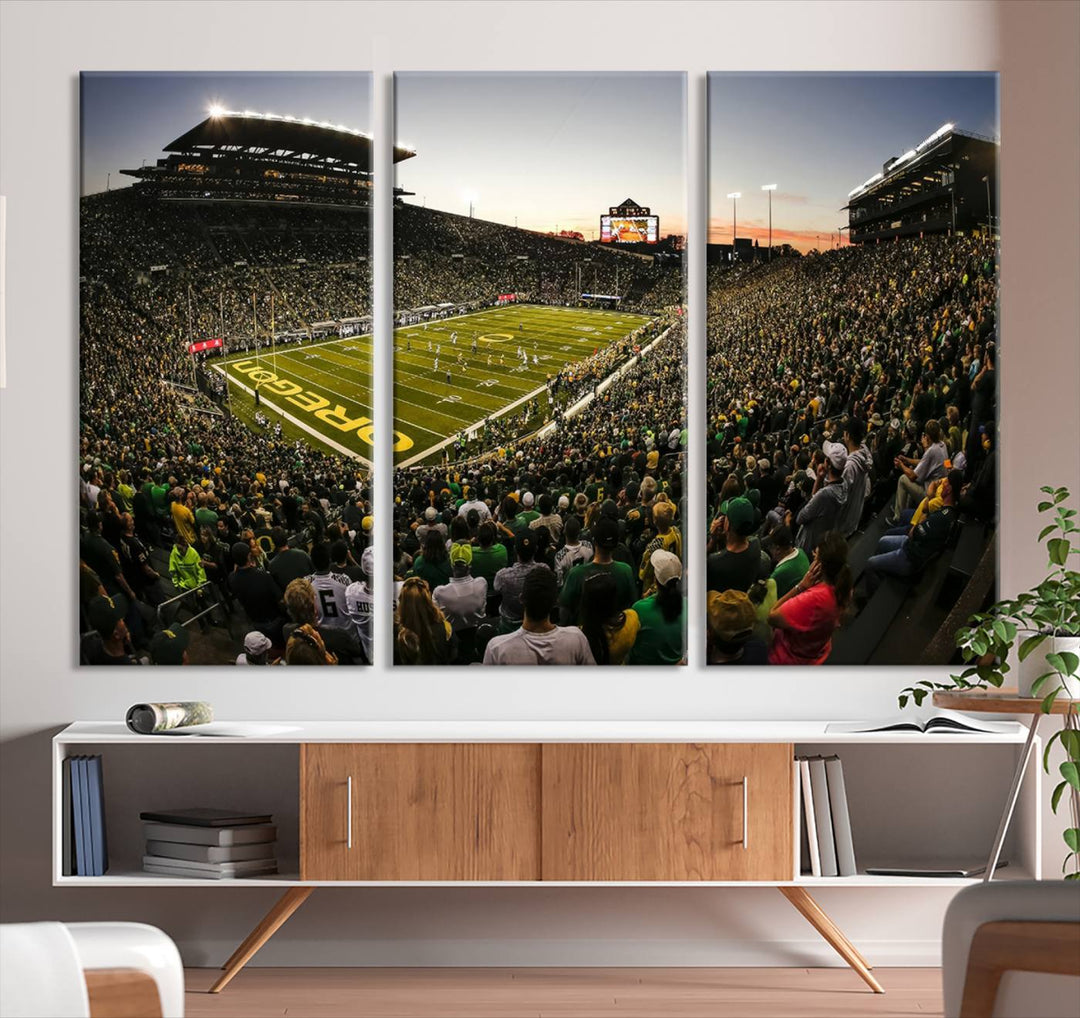 Triple-panel canvas art of Autzen Stadium during an Oregon Ducks evening football game, showing the lively crowd and intense game action.