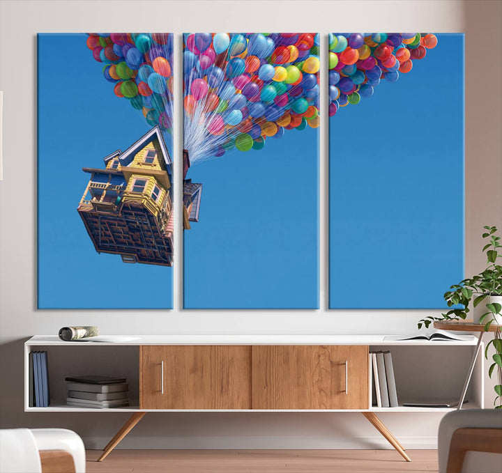 The "Carl Fredricksen, Up Movie Wall Art" features a three-panel design with a house lifted by colorful balloons, adding whimsical decor to any space.