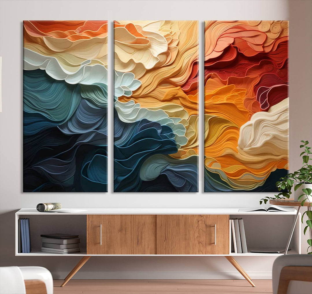 A Blue Orange Abstract Wave Wall Art Canvas Print adorns the wall. This colorful masterpiece is professionally hand-assembled to enhance any space.