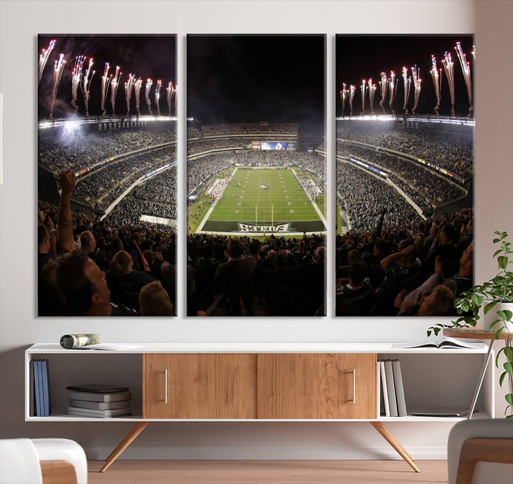 The living room features a spectacular Philadelphia Eagles Football Team Print. This wall art canvas print of Lincoln Financial Field at night captures a Philadelphia Eagles game under the dazzling brilliance of fireworks, making it an eye-catching centerpiece.