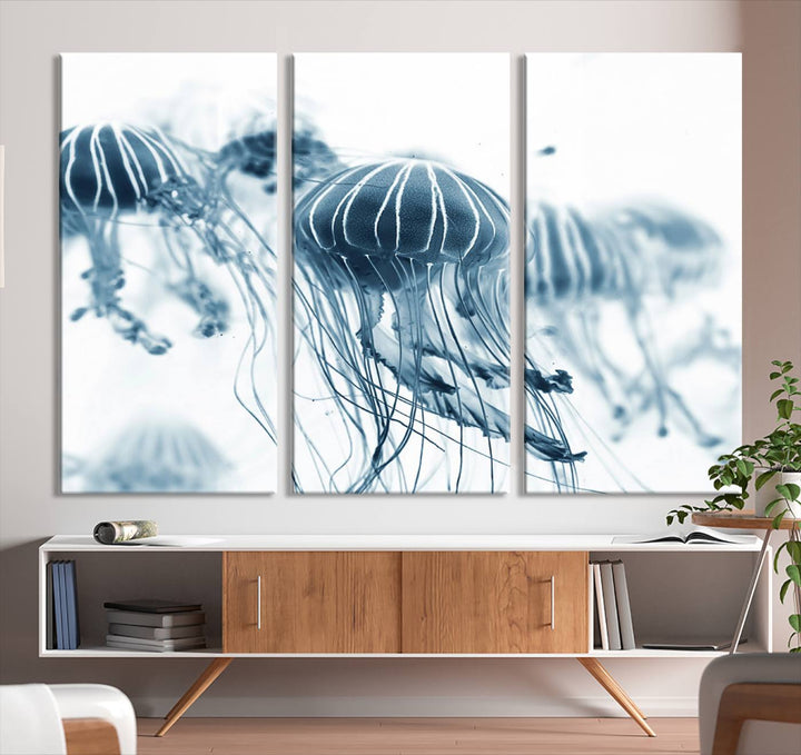 The Abstract Jellyfish Wall Art Canvas Print, a three-panel piece featuring high-resolution printing, hangs elegantly in the room, adding vibrant detail to the space.