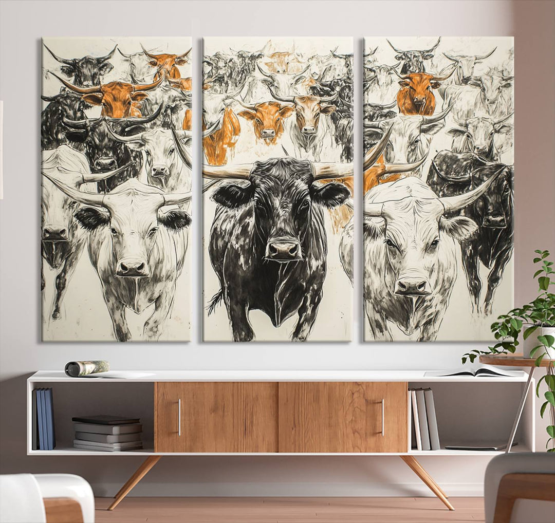 This exquisite farmhouse wall art, titled "Western Longhorn Cattle Canvas Print," showcases a majestic herd of longhorn cattle in a three-panel design. This ready-to-hang and framed barn decor infuses your space with rustic charm.