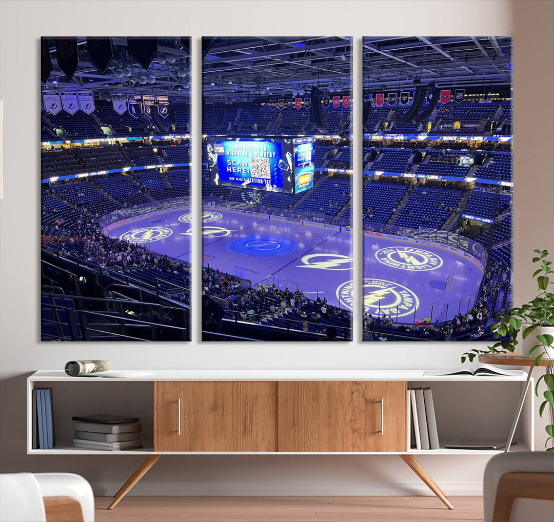 The wall art canvas print at Amalie Arena features team logos on ice, encapsulating the vibrant atmosphere of an NHL hockey stadium.