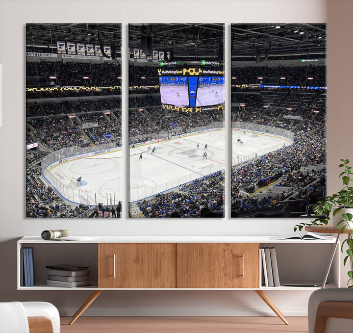 A large Enterprise Center canvas of a crowded hockey arena hangs prominently.