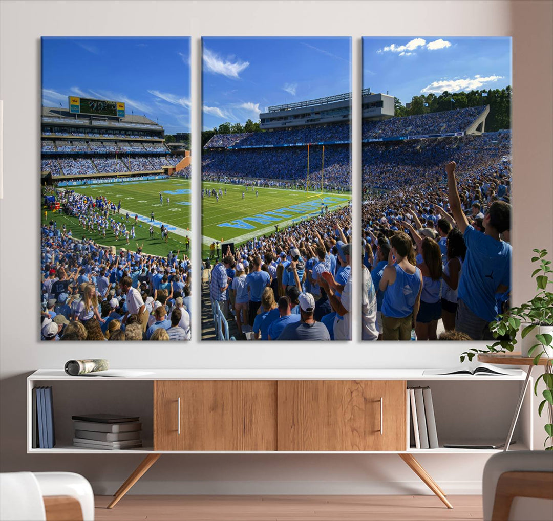 A gallery-quality canvas wall art print featuring the University of North Carolina Tar Heels Football Team and Chapel Hill's Kenan Memorial Stadium adorns the cafe wall.