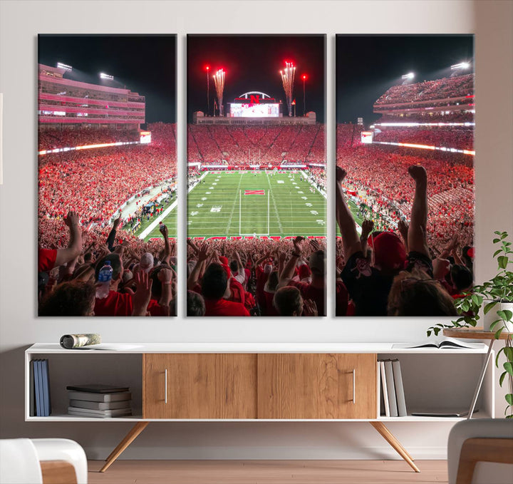 The University of Nebraska Cornhuskers Football Team Print, a vibrant three-panel canvas depicting Lincoln Memorial Stadium filled with enthusiastic fans from the end zone perspective, features a gallery-quality finish.