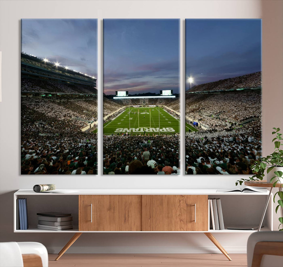 Wall art featuring a stadium at dusk with full stands—ideal for the Michigan State Spartans Football Team Canvas Print.