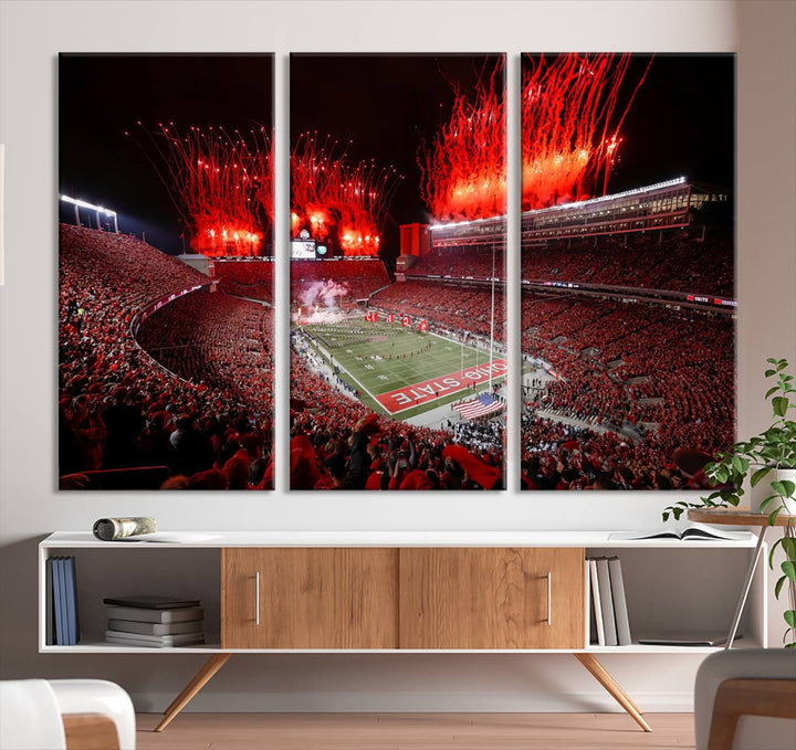 A vibrant red canvas art of a packed Ohio State Buckeyes stadium at night with fireworks.