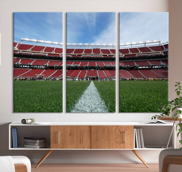 A canvas print of the University of Tulsa Golden Hurricane showcases H.A. Chapman Stadiums football field and red seats against a backdrop of a blue sky.