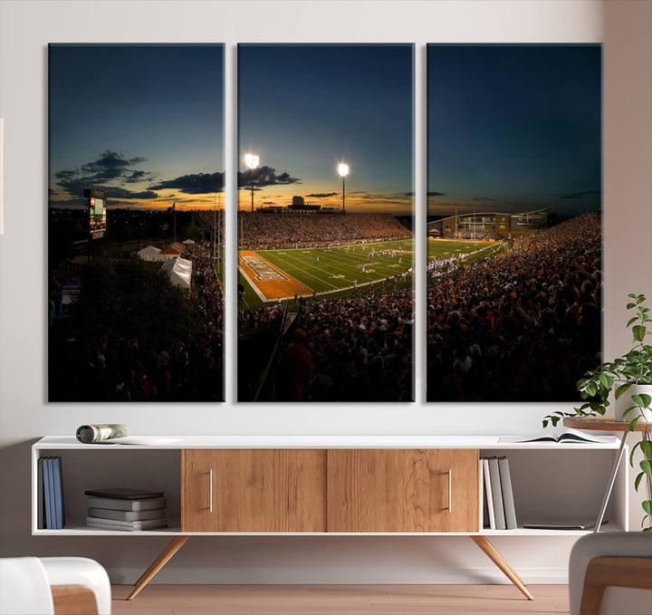 Ball State Cardinals Football Team Print - Muncie Scheumann Stadium Canvas featuring a sunset, floodlights, and lively crowd.