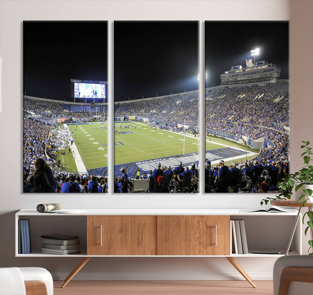 A vibrant depiction of Liberty Stadium at night, highlighting a Tigers football game on the large screen with stands filled with enthusiastic fans.