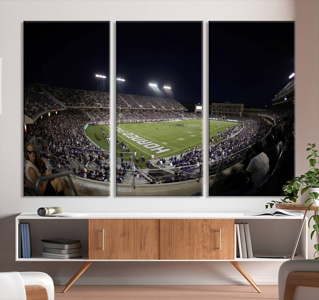 The wall art print features a night view of Amon G. Carter Stadium filled with TCU fans, showcased in the Horned Frogs Football Canvas Wall Art.