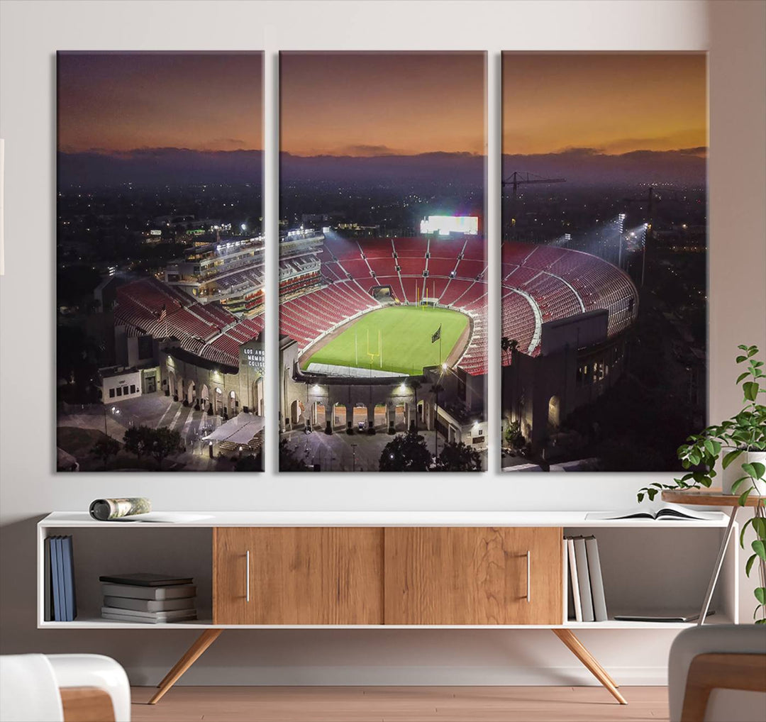 The USC Trojans Stadium canvas captures Memorial Coliseum at twilight, showcasing red seats and a green field beneath an orange sky.