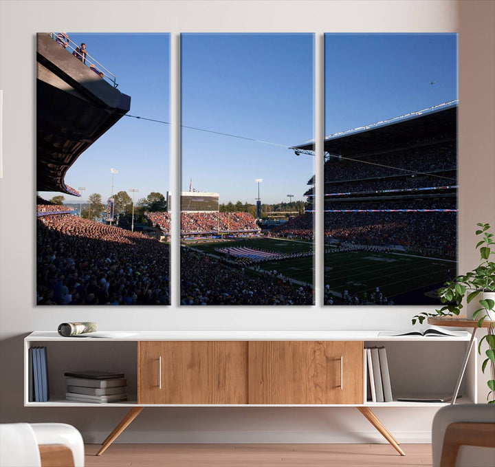 The University of Washington Huskies wall art print depicts Husky Stadium coming alive with fans as flags flutter.