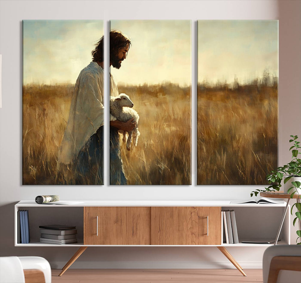 The Jesus the Good Shepherd wall art print depicts Jesus gently holding a lamb under a clear sky.