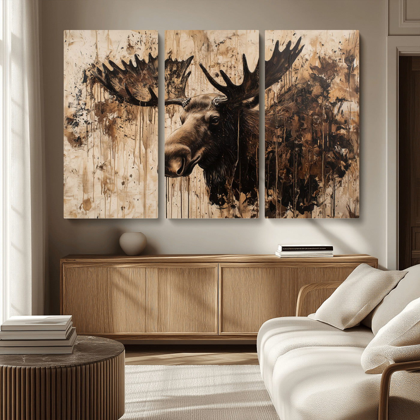 Artistic painting of a moose head with large antlers in shades of brown and black, with paint splatters and drips on a beige textured background, creating a rustic and expressive wall art canvas.