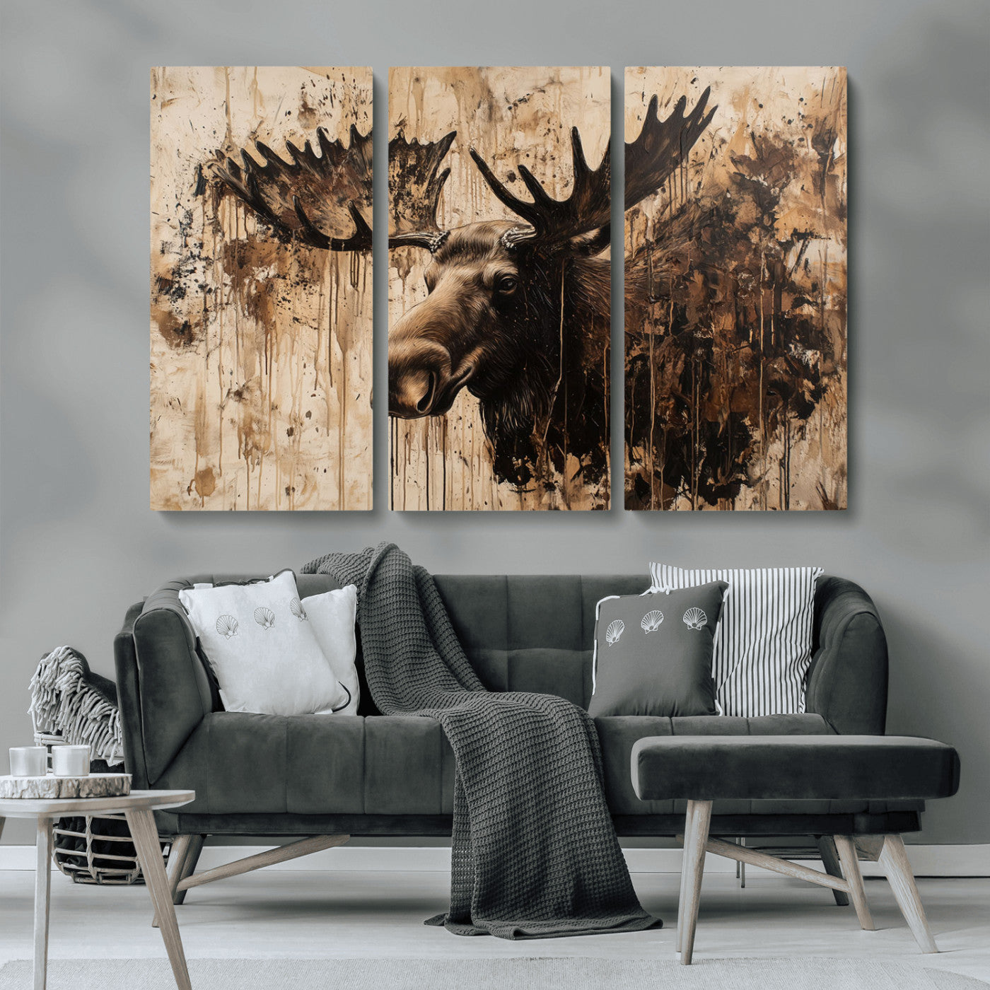 Artistic painting of a moose head with large antlers in shades of brown and black, with paint splatters and drips on a beige textured background, creating a rustic and expressive wall art canvas.