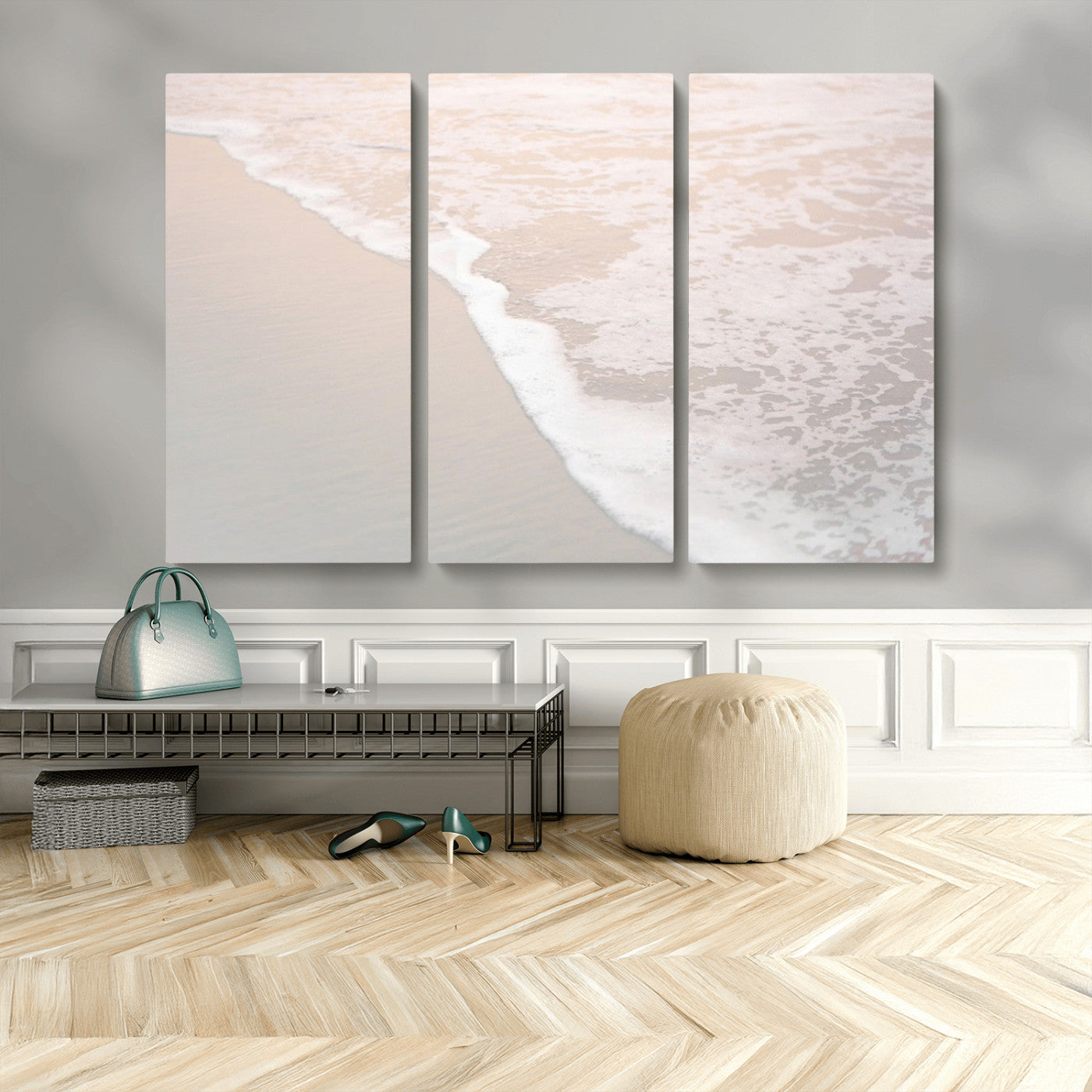 Close-up view of gentle ocean waves washing over smooth, wet sandy beach with soft foam along the shoreline.
