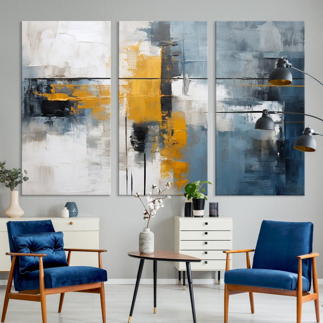 The Orange Abstract Wall Art Print features a series of white, blue, black, and yellow blocks arranged in a triptych format on museum-quality canvases. Proudly made in the USA and offered with free shipping.