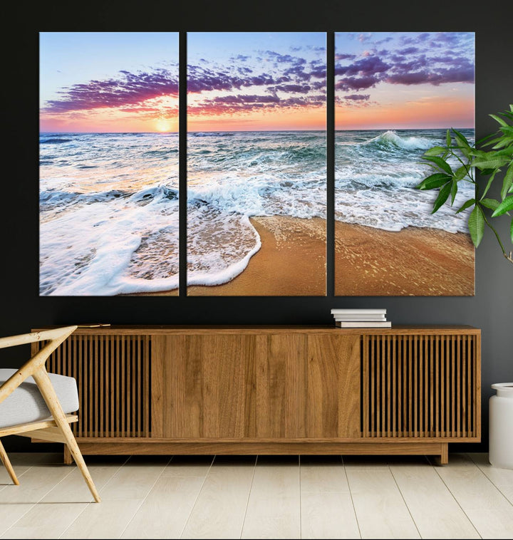 The Tropical Beach Waves Art Print, depicting an ocean sunset and sandy shore, enriches the coastal decor of the dining area.