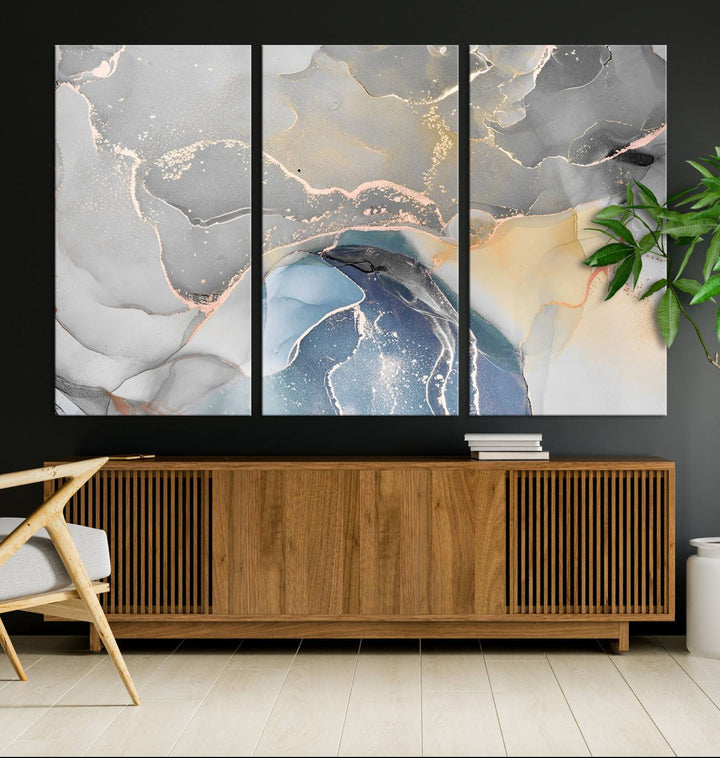 Gray Marble Fluid Effect Abstract Canvas with swirls of gray, gold, and blue.